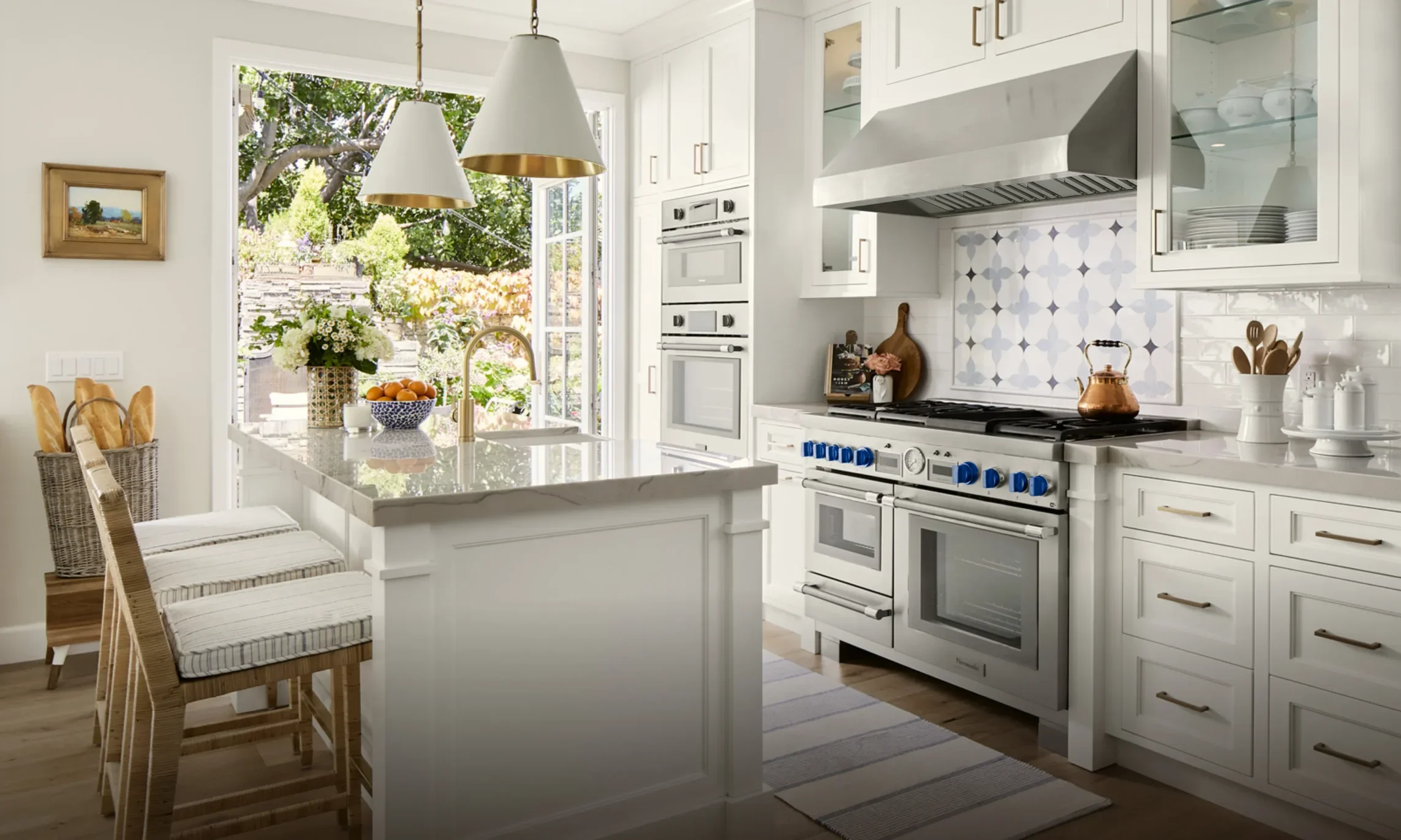 Kitchen in a warm neutral palette with brushed metal fixtures