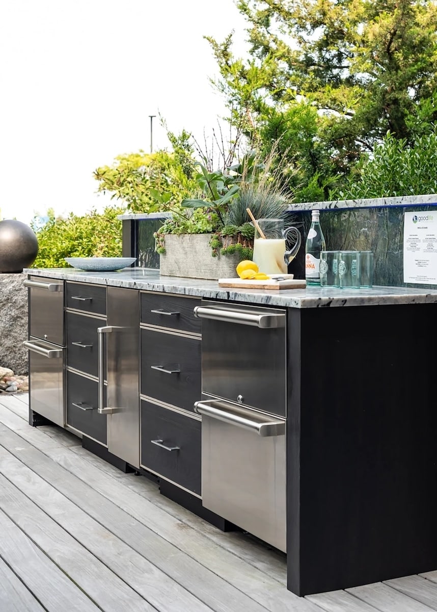 Outdoor kitchen cabinetry in a weatherproof woodgrain finish